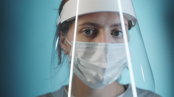 Studio Portrait of Female Doctor in Face Shield and Mask alt