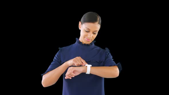 Businesswoman using her smartwatch