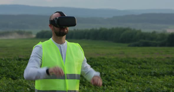 Farm Specialist Engineer Using Technology VR Monitoring Harvest Working for Agriculture Productivity alt