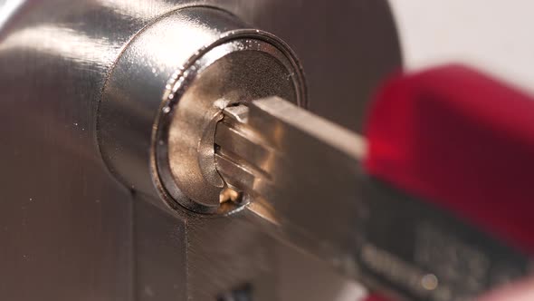 4K - Key opens high security cylinder lock. Close-up alt