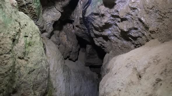 Speleology, cave, dungeon, dark tunnel, underground excavations. The old cave is formed by water alt