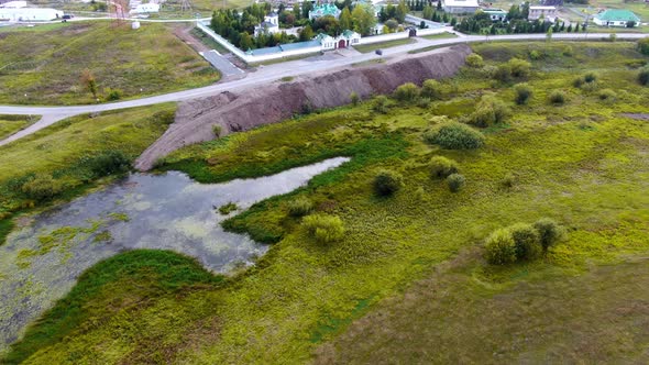 Quadcopter Flies Over the Field and the Monastery alt