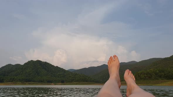 Feet Swaying On Bamboo Raft Relax Holiday In Nature Floating Resort In Dam Surrounding By Mountain