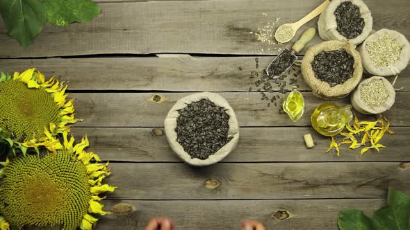Sunflower Oil and Seeds on an Old Wooden Table. Flat Lay. alt