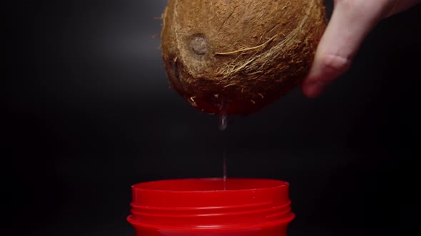 Pouring the Coconut Water to the Red Cup