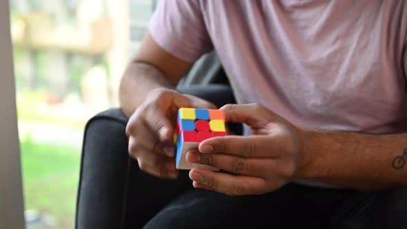 Young Man Solving A Rubiks Cube Long Clip 4 alt