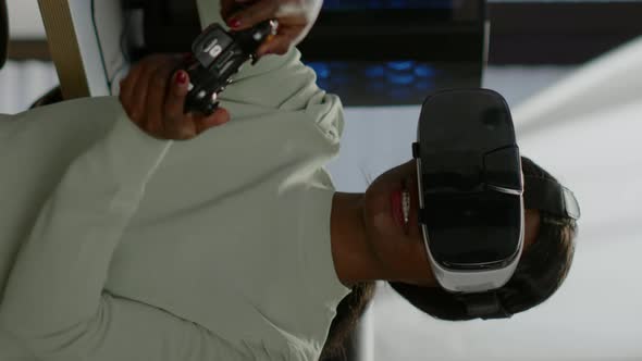 Vertical Video Winner Player Holding Joystick Playing Videogame Using VR alt