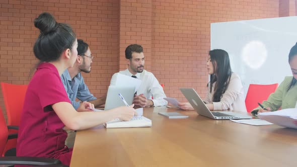 Group of business man and woman people have meeting brainstorming and working together in office. alt