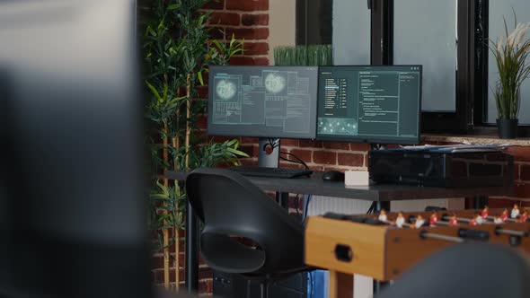 Desk with Multiple Computer Monitors Displaying Neural Network Visualisation alt