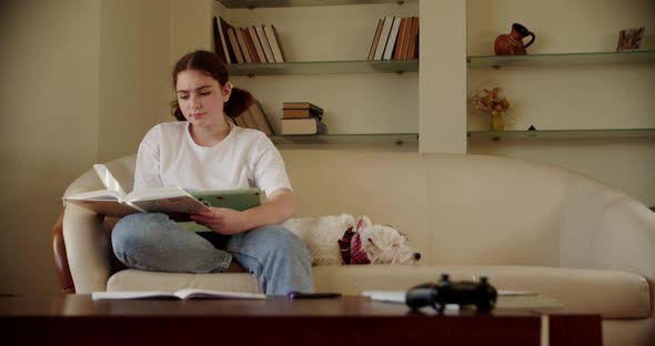 Girl Using Digital Tablet Technology Device in an Online Lesson Talking on Video Via Tablet alt