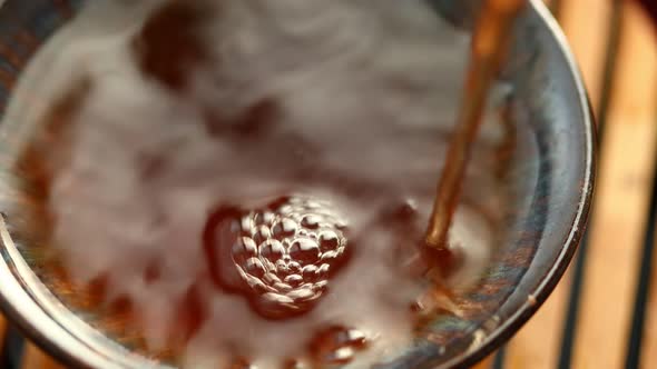 Chinese Tea is Poured Into a Bowl