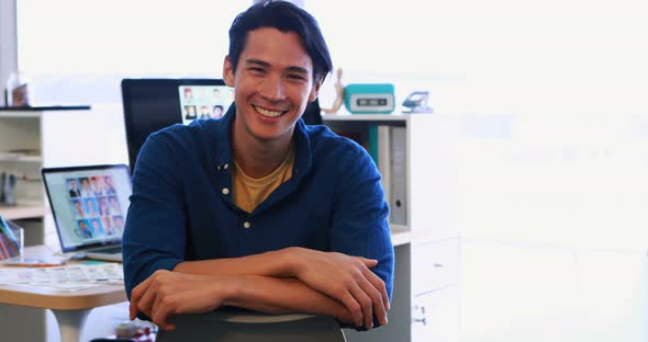 Male executive sitting at his desk in office 4k alt