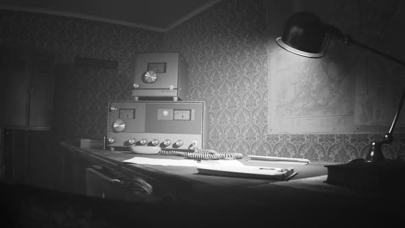 Retro room with vintage radio station standing on the desk under obsolete lamp. alt
