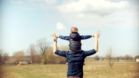 Sons Relaxing Carefree Father. Happy Family Cheerful Dad Playing Cute Little Child Boys On Park. alt