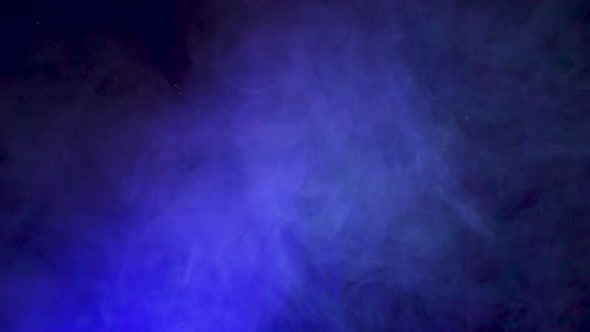 Blue smoke on a black background, abstract