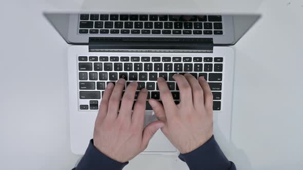 Top View of Hands Typing on Laptop alt