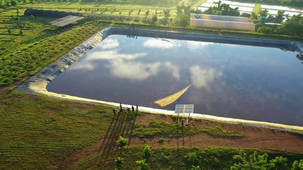 Fish farmers netting their fish in Africa. Shot on a canon eos r and 70-200 f2.8. alt