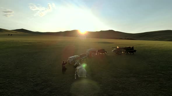 Central Asian Family People Walking Immigrating With Traditional Old Oxcart Tumbrel And Tumbril Cart alt