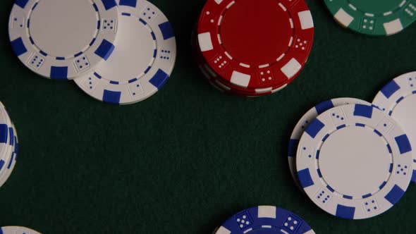Rotating shot of poker cards and poker chips on a green felt surface - POKER 029 alt