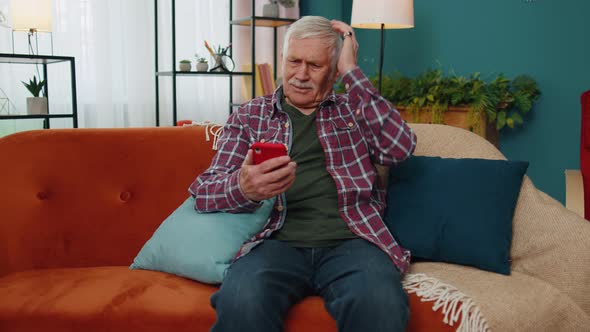 Sad Senior Granfather Use Mobile Smartphone Loses Becoming Surprised Sudden Bad Lottery Results News alt