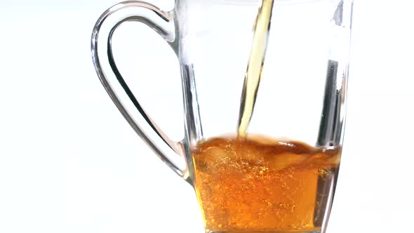 Fill a Transparent Glass with a Delicious Drink. The Drink Is Poured Into a Glass Transparent Tea alt