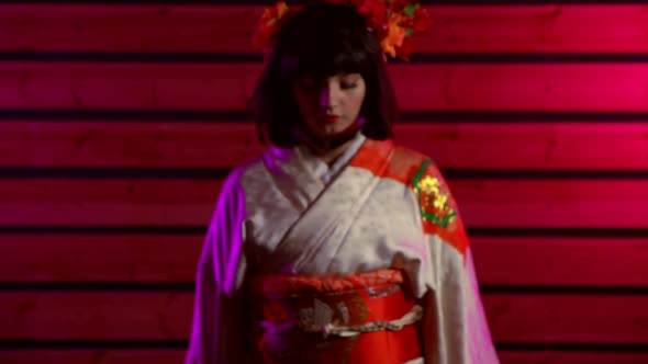 Woman Is Dressed in Traditional Oriental Gown Is Moving To Camera in Slow Motion alt