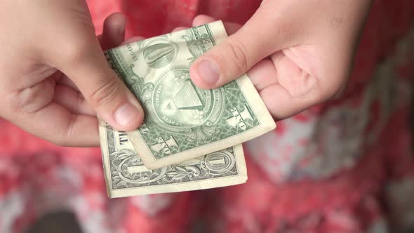 One Dollar in Children's Hands