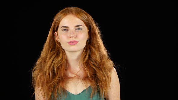 Redhaired Girl Flirting. Black Background alt