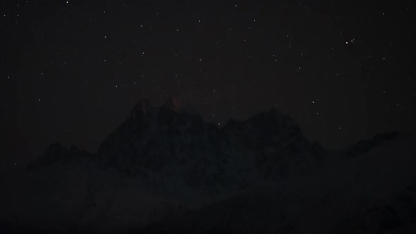 Timelapse of Moonrise in Mountain Night Stars Sky.