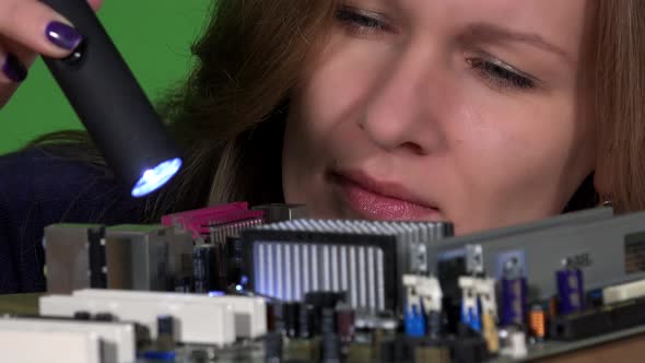 Beautiful Engineer Woman Looking at Pc Motherboard Microchips and Connectors