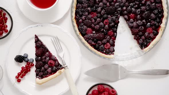 Delicious Homemade Piece on a Plate and the Whole Homemade Forest Berry Tart