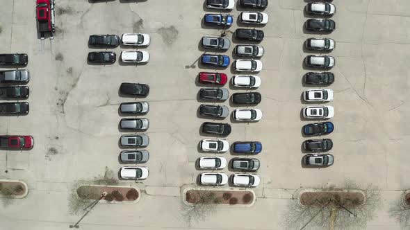 Aerial Drone Shot of the Car on Parking of the Dealer Lot and Car Carrier Trailer Car Hauler Loads alt