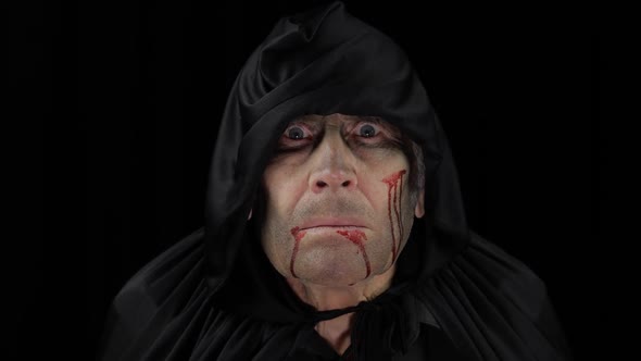 Old Executioner Halloween Makeup and Costume. Elderly Man with Blood on His Face alt