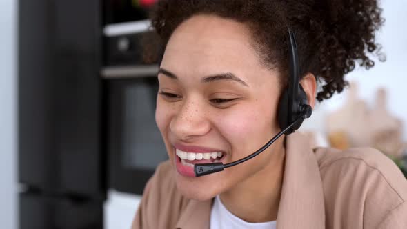 Closeup of Successful Pleasant African American Girl with Headset Expert Consultant or Call Center alt