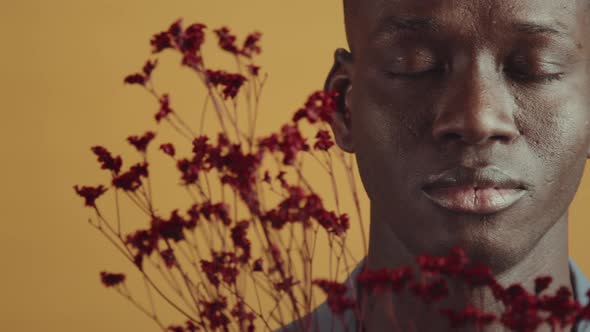 Black Man With Red Flowers alt