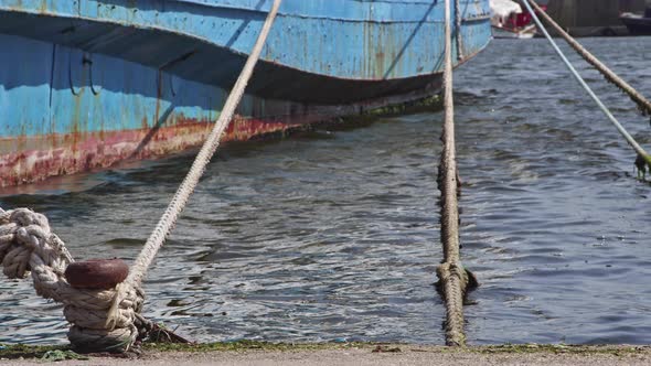 Rusty Mooring Bollard With Old Ship Ropes  alt