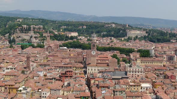 Drone approaching Piazza delle Erbe (Market square) in Verona city, Italy alt