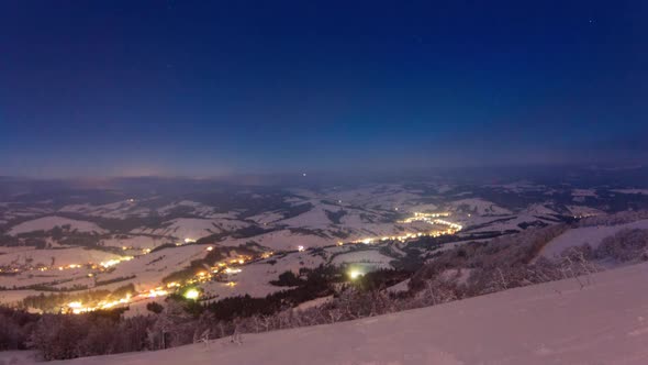 Time Lapse Video with Blue Sky Fog and Snow of a Starry Sky Over Snowy Ski Resort in the Mountains alt