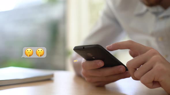 Young man chatting on smartphone alt