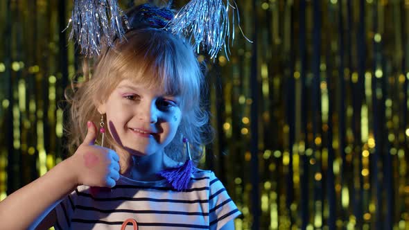 Futuristic Hipster Teen Girl Showing Thumbs Up in Slow Motion at Disco Party Club in Blue Neon Light alt