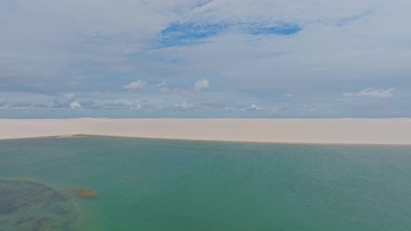 Traveling Sideways, White Sand Dune, Blue Green Water In A Paradise In Brazil