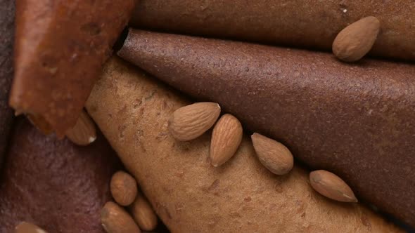 Almond drops at homemade fruit leather view from the top. Vegan healthy dessert concept alt