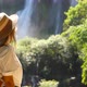 Travel Woman Enjoy Amazing View of Waterfall Nature - VideoHive Item for Sale