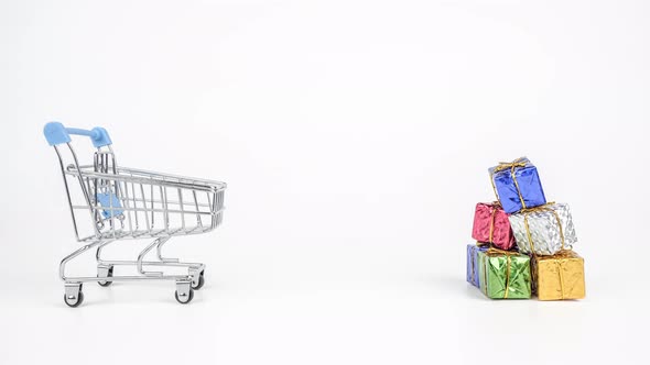 Stop motion animation Empty shopping cart are carrying gift box isolated on white background