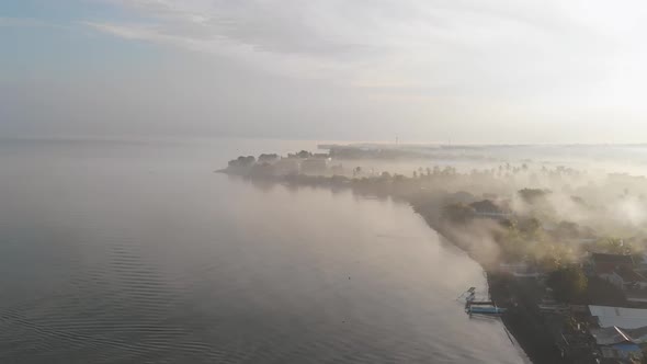 Aerial View Over Foggy Coastline