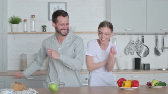 Man and Woman Dancing in Kitchen alt
