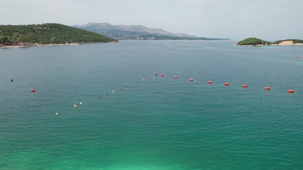 Aerial View Azure Beach with Empty Sun Loungers Balkan Coast Ionian Sea Albania alt