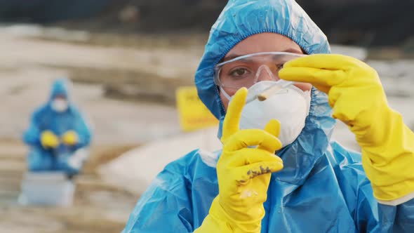 Female Ecologist Checking Material For Analysis alt