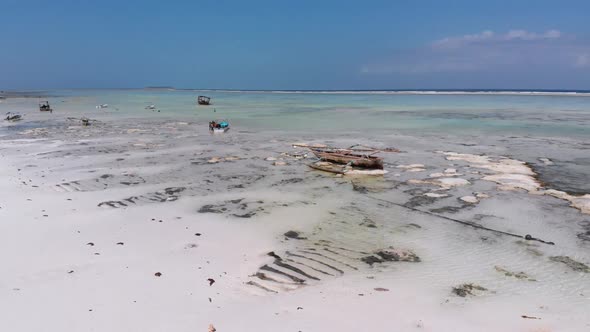 Ocean at Low Tide Aerial View Zanzibar Boats Stuck in Sand on the Shallows alt