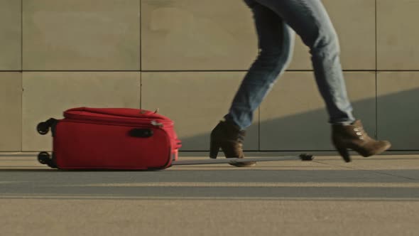 Very Hurrying Woman Drops Her Suitcase